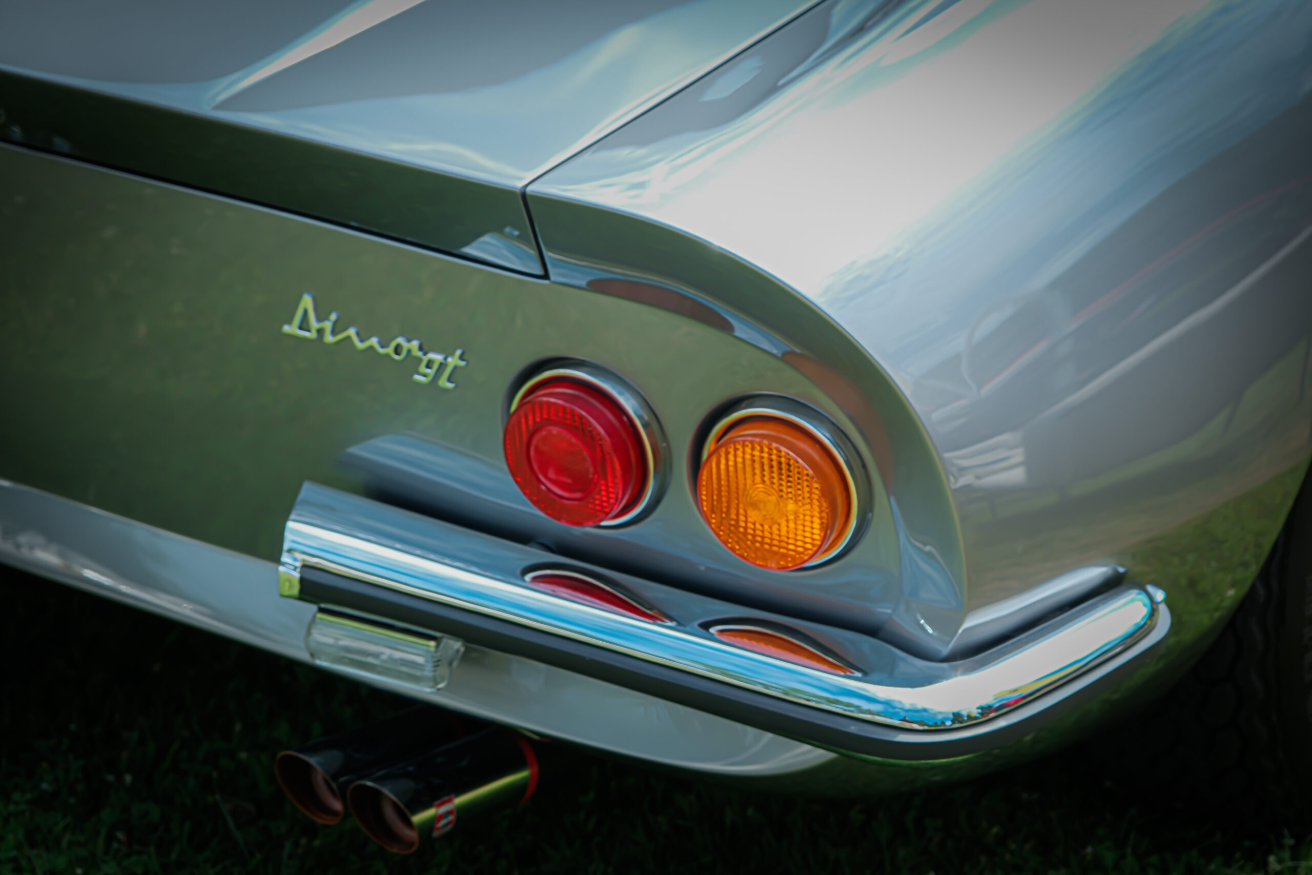 Rear light detail of a classic Ferrari Dino sports car.