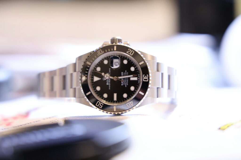 Rolex Submariner with black dial, rotating bezel and steel bracelet
